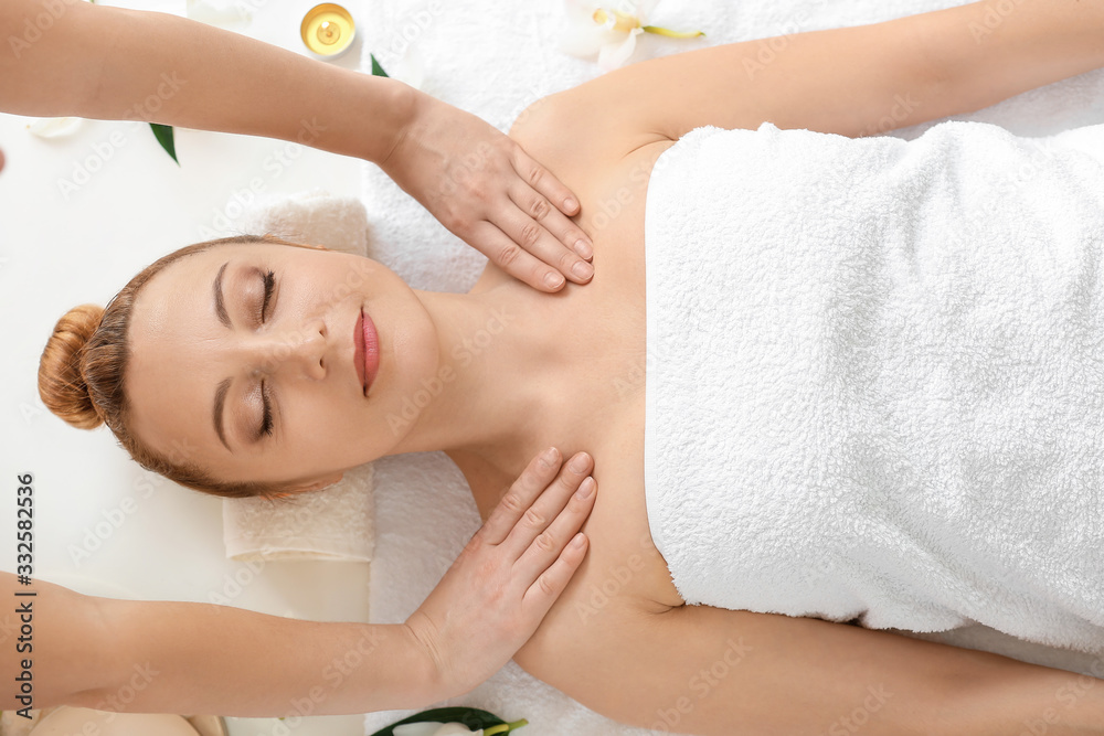 Beautiful woman receiving massage in spa salon Beautiful woman receiving massage in spa salon