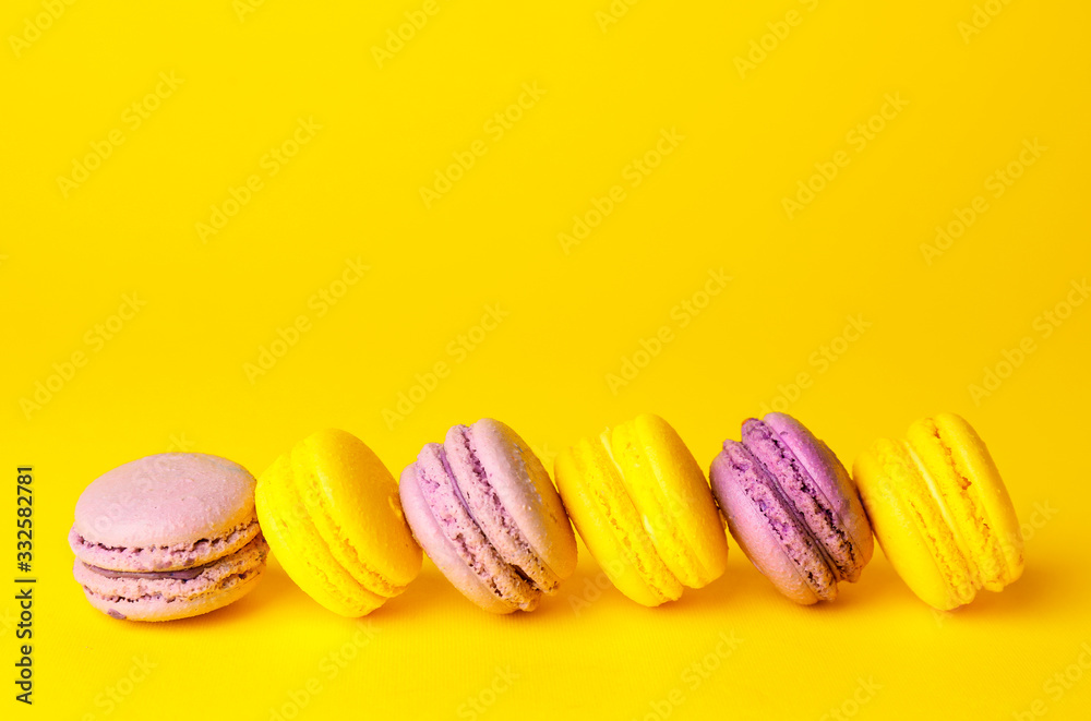 Tasty macarons on color background