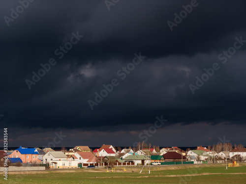 storm clouds thunderclouds over the village in spring