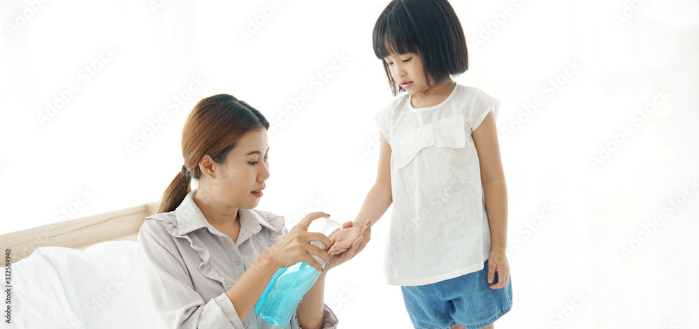 Young mother washs her baby's hand by using a hand wash sanitizer gel. In the epidemic virus situation Young mother washs her baby's hand by using a hand wash sanitizer gel. In the epidemic virus situation