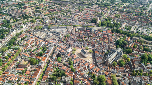 Aerial drone view of Delft town cityscape from above, typical Dutch city skyline with canals and houses, Holland, Netherlands