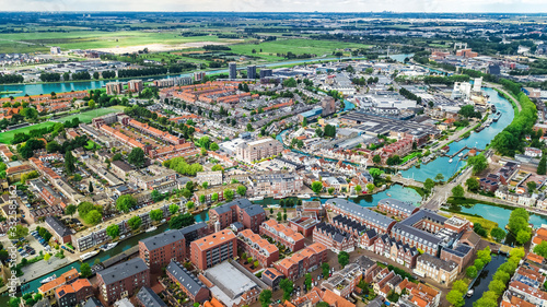 Aerial drone view of Delft town cityscape from above, typical Dutch city skyline with canals and houses, Holland, Netherlands © Iuliia Sokolovska