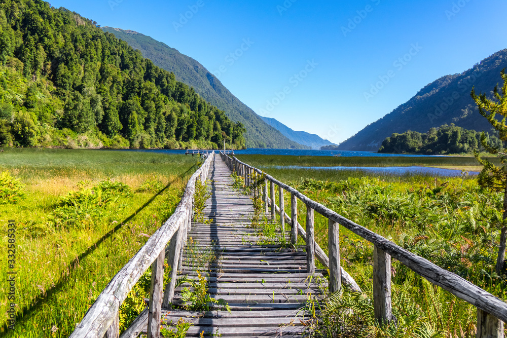 Wooden bridge across river Murta, landscape with beautiful mountains view, Patagonia, Chile, South America