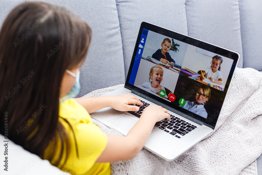 Coronavirus home school concept, quarantine. Girl doing homework. Modern lifestyle Coronavirus home school concept, quarantine. Girl doing homework. Modern lifestyle