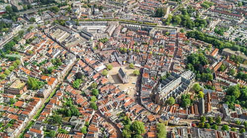 Aerial drone view of Delft town cityscape from above, typical Dutch city skyline with canals and houses, Holland, Netherlands