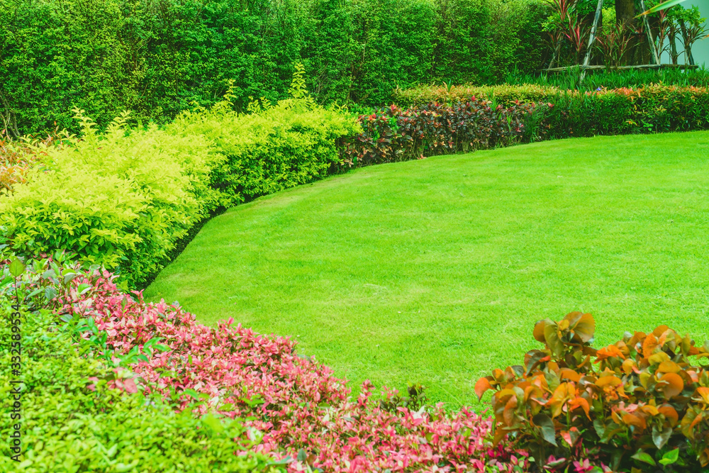 Landscaped Formal, Front yard with garden design, Green lawn, Garden design, Landscaping in the garden, Gardening for the background. Landscaped Formal, Front yard with garden design, Green lawn, Garden design, Landscaping in the garden, Gardening for the background.