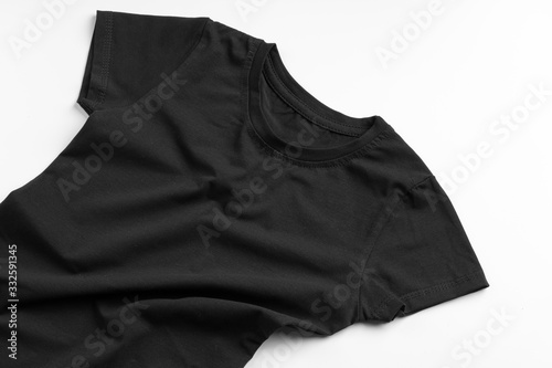 Black color plain t-shirt with copy space close up © fotofabrika