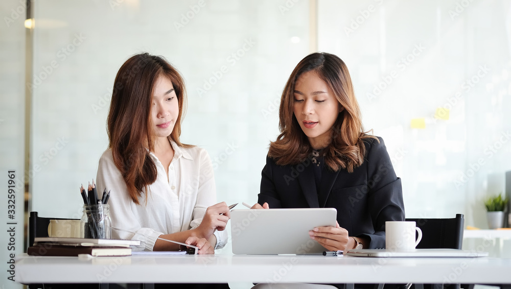 Concept business woman working and people happy businesswoman or creative female office worker with computers writing to notebook with documents and laptop. Concept business woman working and people happy businesswoman or creative female office worker with computers writing to notebook with documents and laptop.