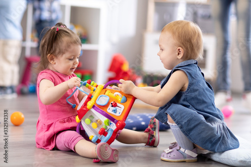 Two kids playing with block...
