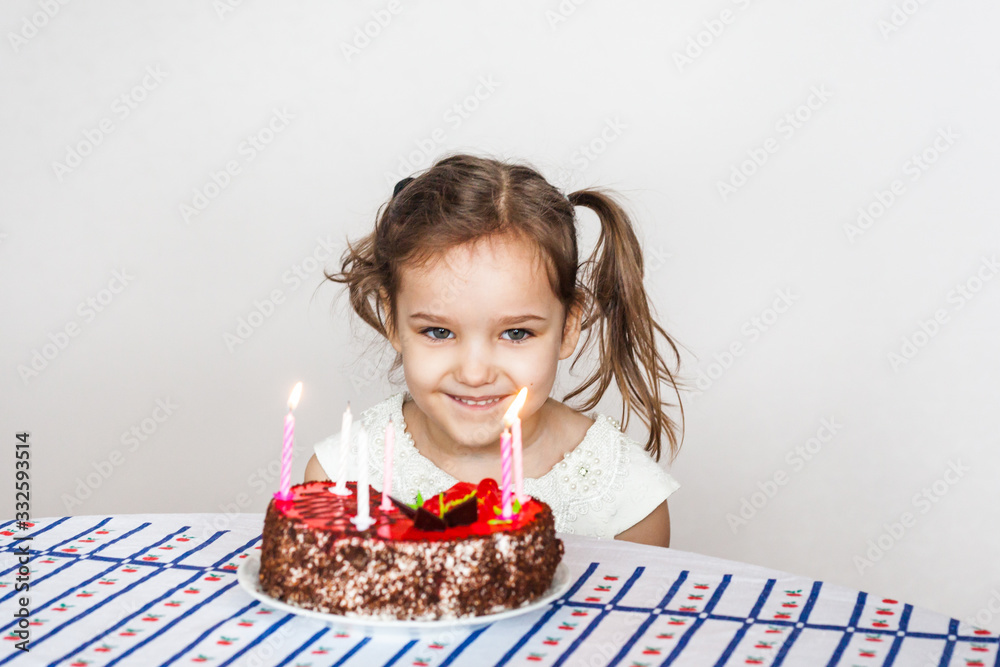little girl and birthday cake, blows out candles, makes a wish, cake and candles, birthday gifts, family, mom and dad little girl and birthday cake, blows out candles, makes a wish, cake and candles, birthday gifts, family, mom and dad