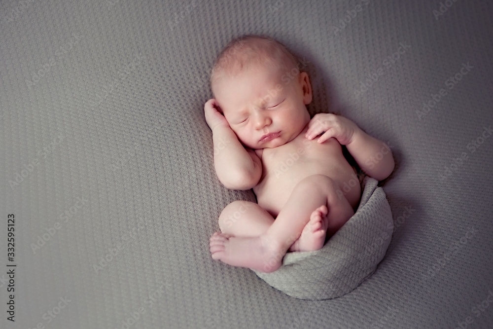Newborn baby session. Child baby portrait . Sweet tot little child on a blanket background. Newborn baby session. Child baby portrait . Sweet tot little child on a blanket background.
