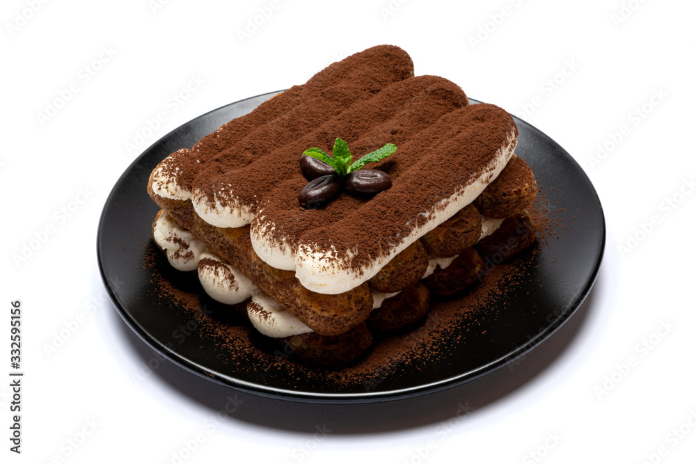 Classic tiramisu dessert on ceramic plate isolated on white background with clipping path Classic tiramisu dessert on ceramic plate isolated on white background with clipping path