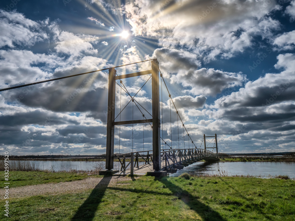 Fototapeta premium Kong Hans suspension bridge in Skjern meadows Ringkoebing, Denmark