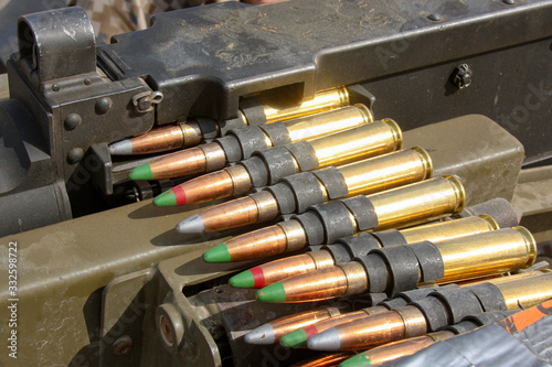 50.cal ammunition belt loaded into machinegun photo