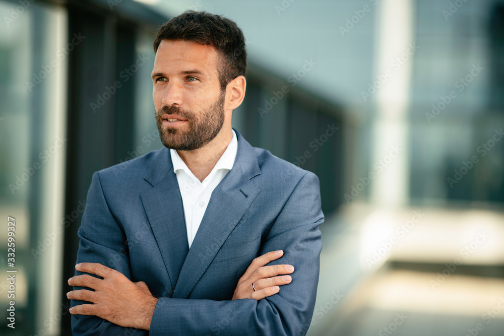 Businessman in a blue suit. Young handsome man outdoors. Businessman in a blue suit. Young handsome man outdoors.