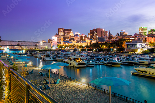 Old Montreal street view with historical buildings. Old Port of Montreal by night. View of old port in Montreal. Montreal Downtown Panorama 