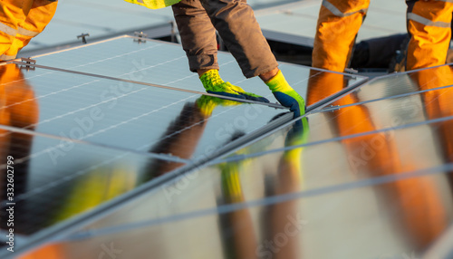 Installation of solar power plant on the rooftop of a building photo