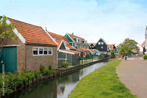 View of traditional Dutch houses along a canal in spring, Zaandam, Netherlands