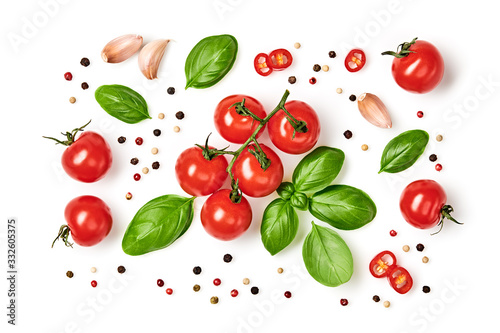 Tomato cherry, basil, spices, garlic, chili pepper. Fresh organic tomatoes, isolated on white. Vegan veggies diet food. Basil, herb, cherry tomatoes, cooking concept, top view.