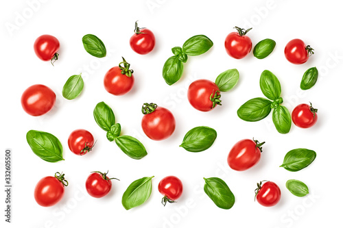 Tomato, basil . Vegan diet food, creative cherry tomato composition isolated on white. Fresh basil, tomatoes pattern layout, cooking concept, top view.