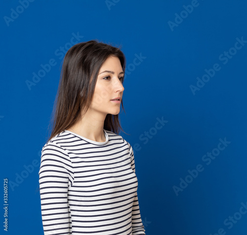 Brunette young woman wearing a striped T-shirt