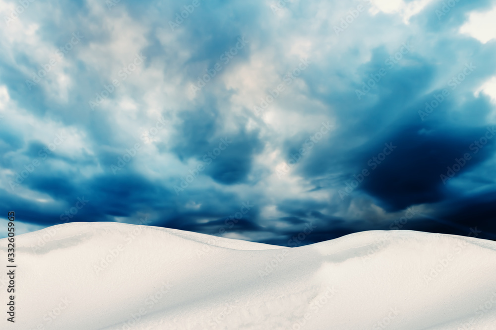 Winter Landscape with Snow Dunes and Cloudy Sky on Background