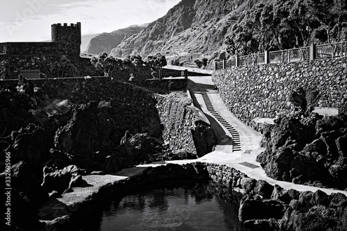 A tower near a narrow road and a natural pool (Madeira, Portugal, Europe)