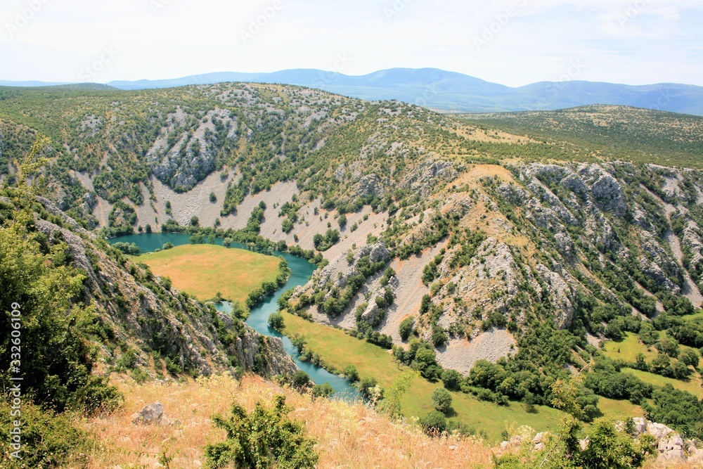 valley and bend in the blue Krupa river, Croatia