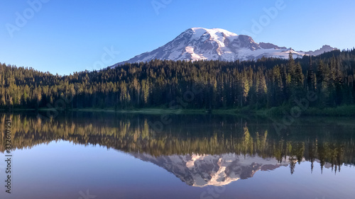 calm summer morning view of mt rainier and reflection lake