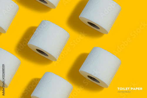 Toilet paper pattern on top on yellow background for banner or advertisement.