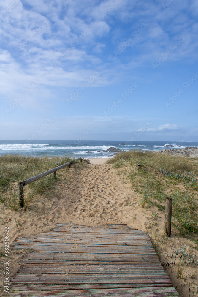 Dunes of Corrubedo, beach and walk, Galicia, Spain. Beautiful wooden walk path in dune beach in the north of Spain. 