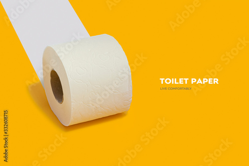 Roll of toilet paper on top on a yellow background for advertising