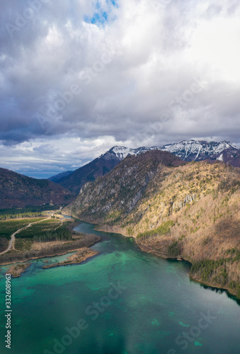 Aerial view of Almsee lake in the austrian alps during Spring