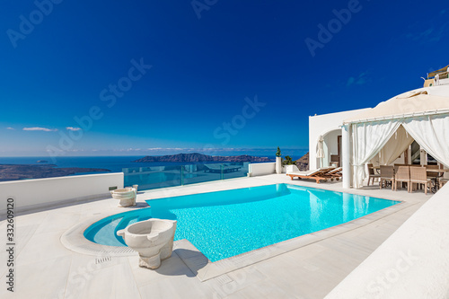 Luxury summer travel and vacation landscape. Swimming pool with sea view. White architecture on Santorini island  Greece. Beautiful landscape with sea view