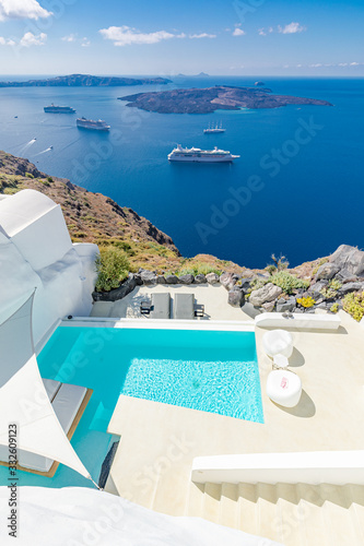 Fototapeta Naklejka Na Ścianę i Meble -  Luxury summer travel and vacation landscape. Swimming pool with sea view. White architecture on Santorini island, Greece. Beautiful landscape with sea view
