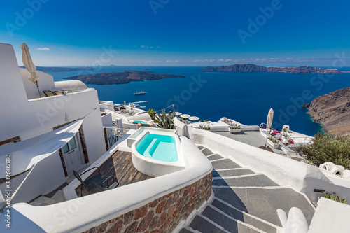 Luxury summer travel and vacation landscape. Swimming pool with sea view. White architecture on Santorini island  Greece. Beautiful landscape with sea view