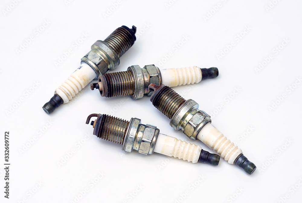 Car spark plug , operating on a white background Car spark plug , operating on a white background