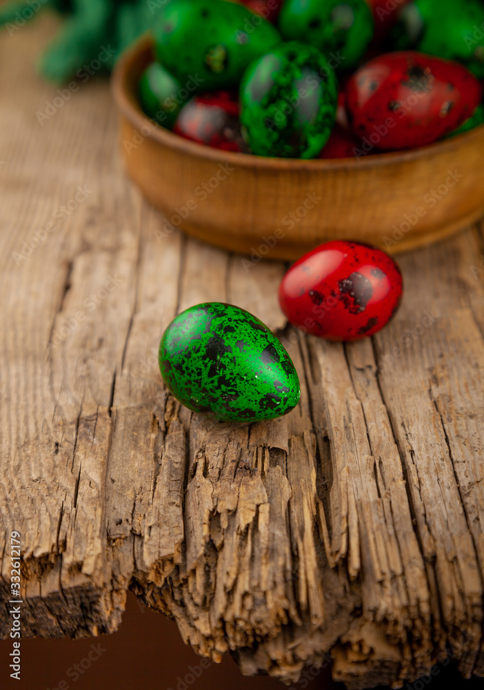 Easter eggs background. Green and red eggs. Colorful Quail colored eggs. Place for text. Different little painted egg set. Dietary nutrition. 