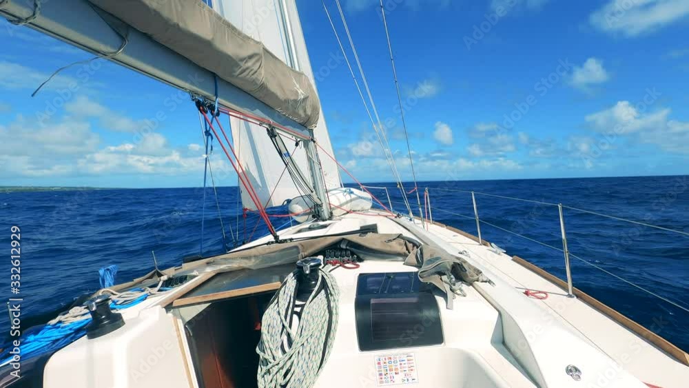 White boat sailing on the sea during day.