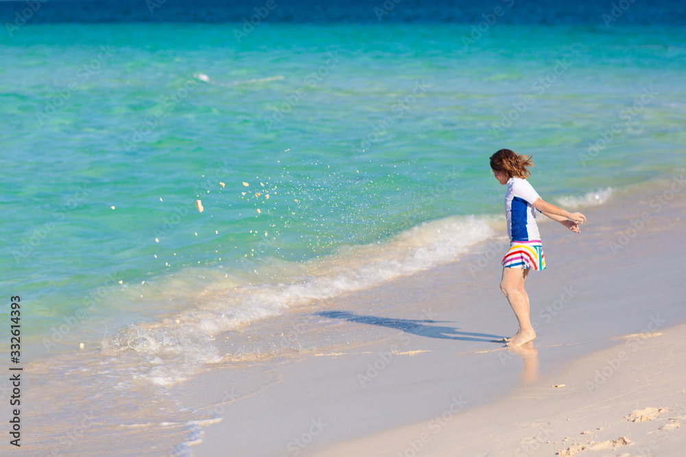 Kids playing on beach. Children play at sea. Kids playing on beach. Children play at sea.