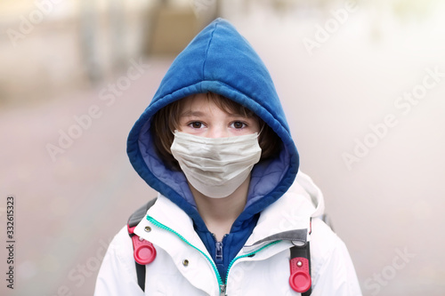 School child in face mask. Coronavirus quarantine.