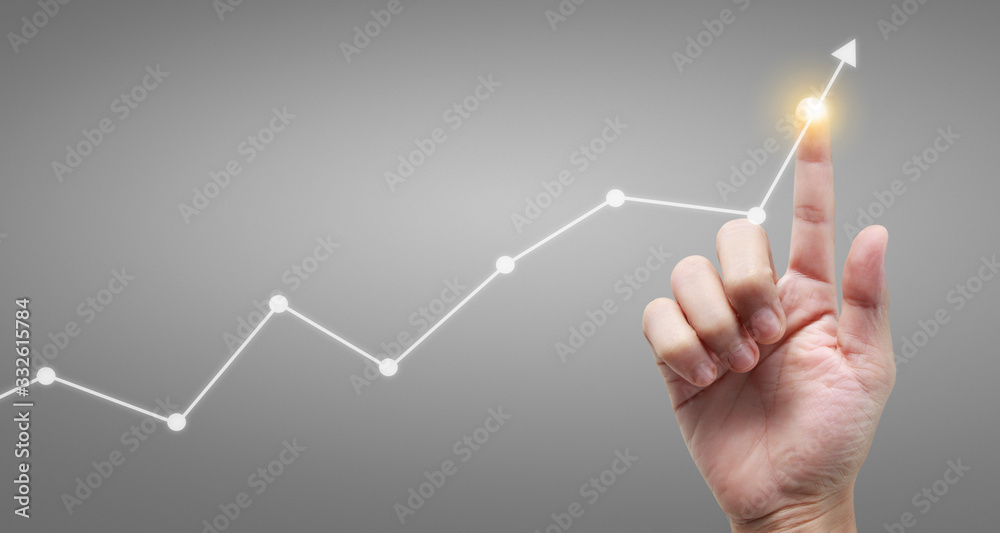 Hand touching graphs of financial indicator and accounting market ...
