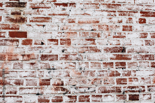 Foto photo of an old brick wall covered with white paint
