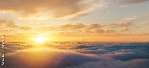 Beautiful sunrise cloudy sky from aerial view © Jag_cz