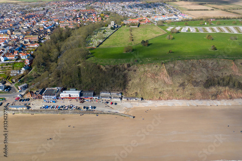 Aerial photo of the British seaside town of Filey, the seaside coastal town is located in East Yorkshire in the North Sea coast showing the beach and ocean. © Duncan