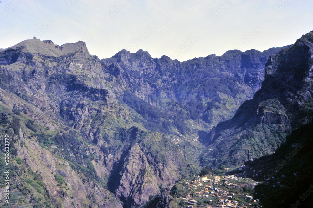 bird eye view of the volcanic mountains of Madeira with villages
