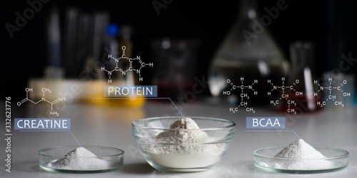 Sport Nutrition Supplement in lab. Chemical formula of creatine, whey protein, BCCA.