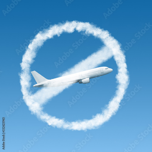 Warning sign from clouds with crossed out plane.
