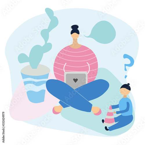 Cute young mom freelancer works at home at the loptop.