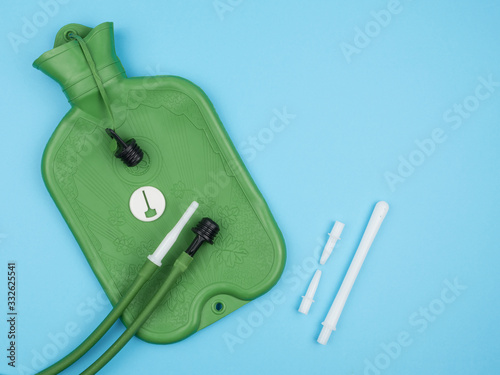 Vászonkép Enema, and accessories on blue background.